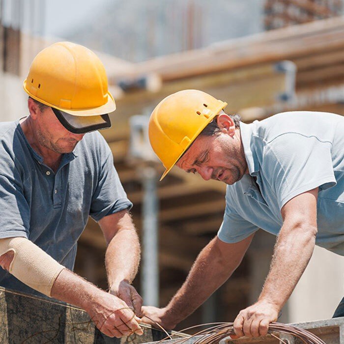 two workers on construction site